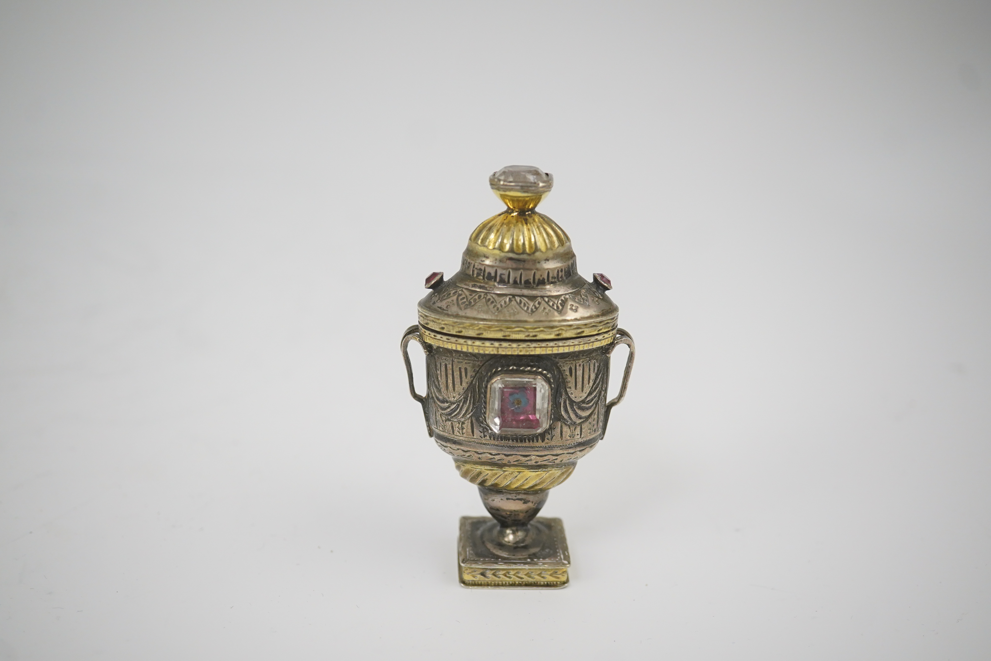 A 19th century continental parcel gilt silver and gem set double ended pill box, modelled as a two handle vase